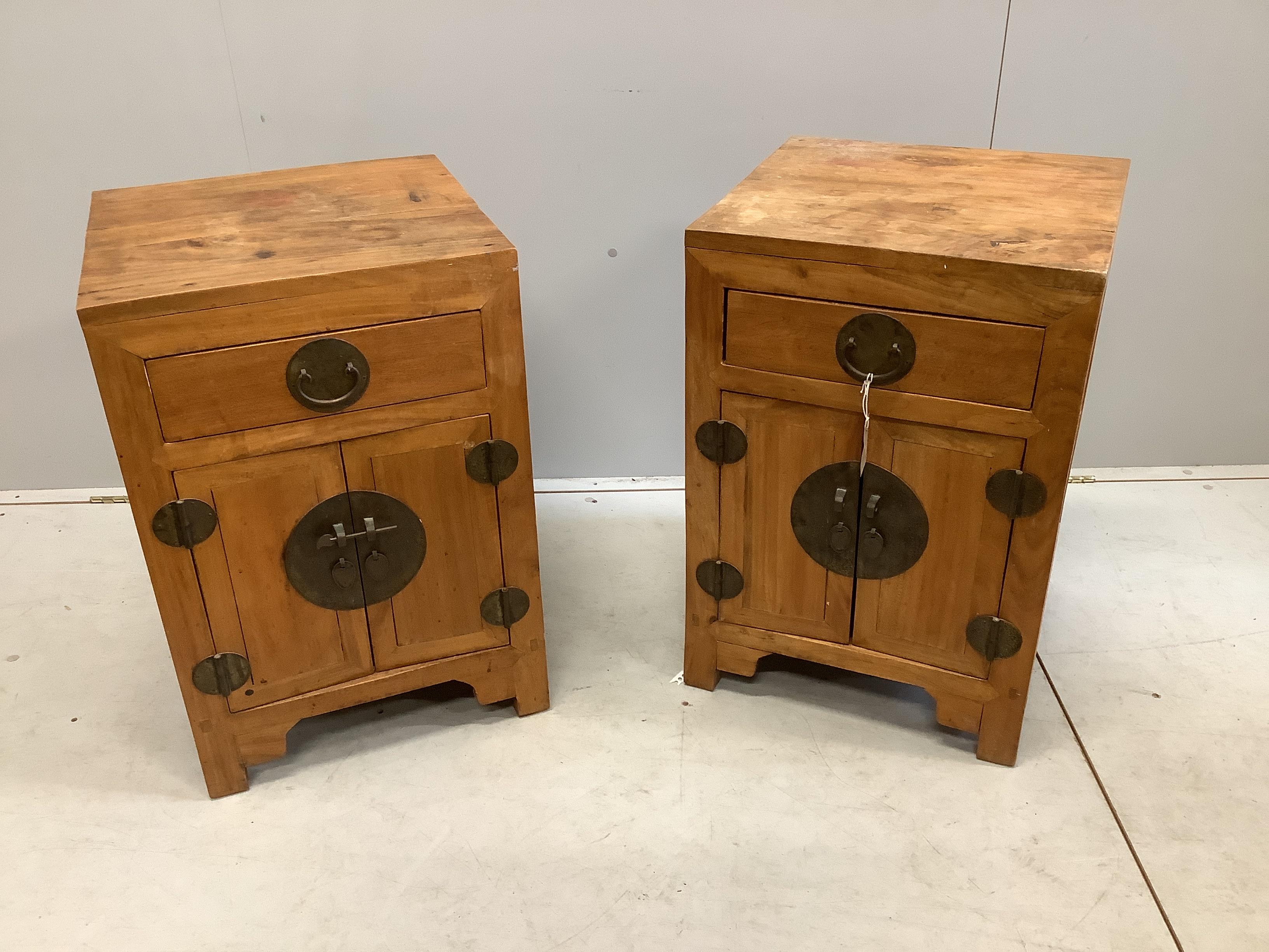 A pair of Chinese camphorwood bedside chests, width 46cm, depth 45cm, height 68cm